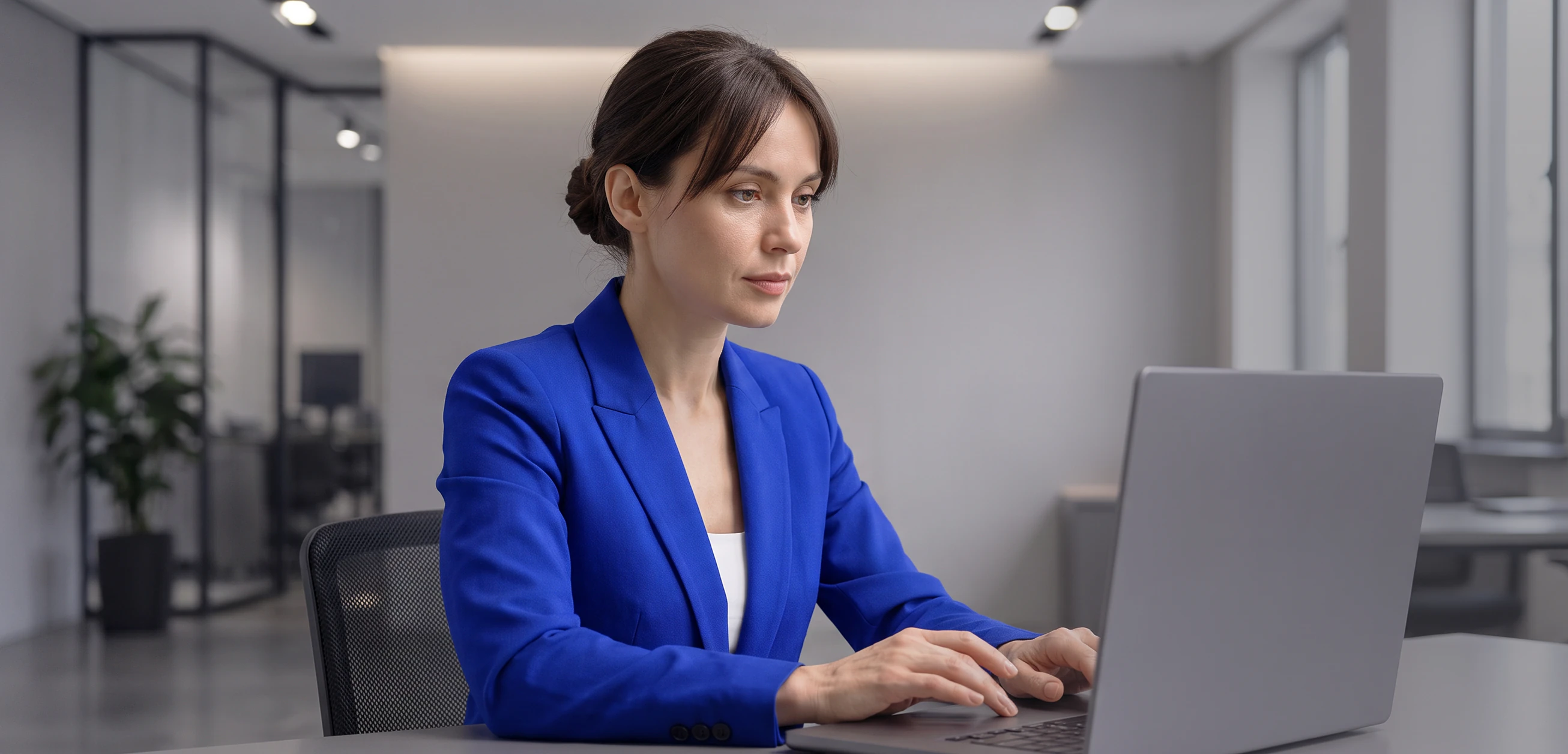 A woman working on a laptop