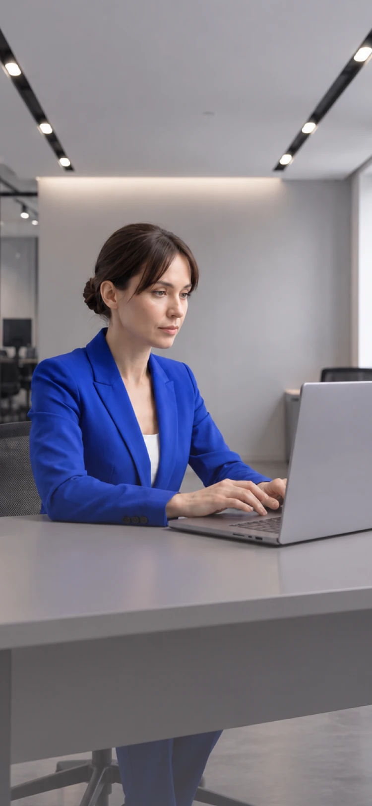 A woman working on a laptop